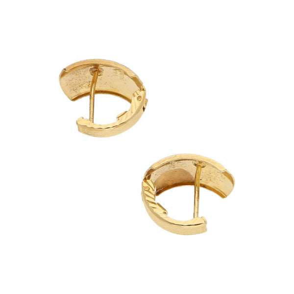 Aretes labrados en oro amarillo 14 kilates.