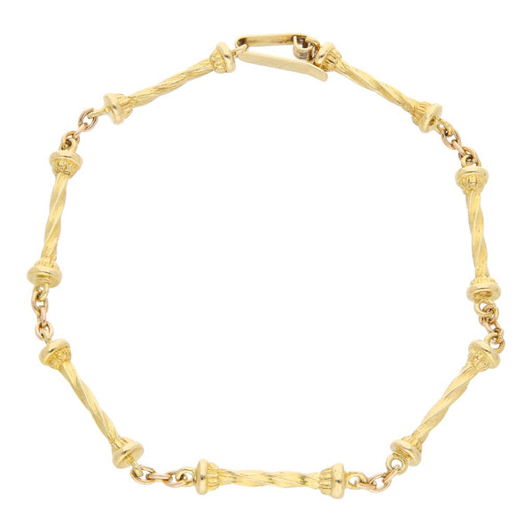 Pulsera eslabón combinado en oro amarillo 18 kilates.