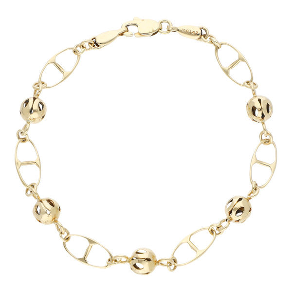 Pulsera eslabón combinado con aplicaciones motivo esferas en oro amarillo 14 kilates.