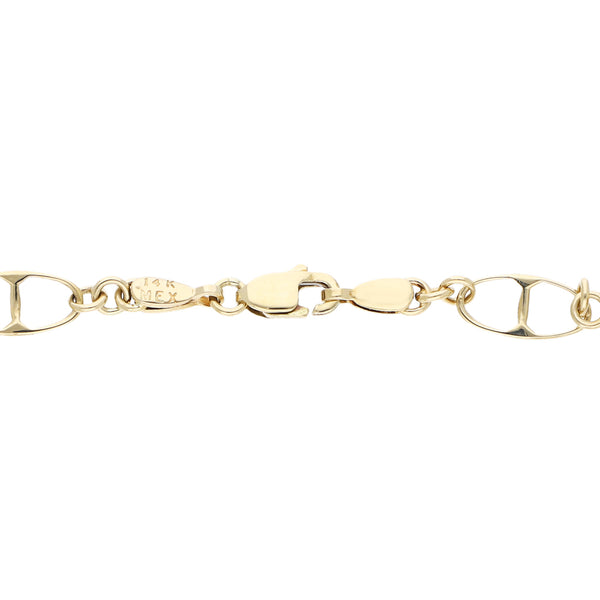 Pulsera eslabón combinado con aplicaciones motivo esferas en oro amarillo 14 kilates.