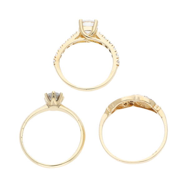 Tres anillos diseño especial con circonias en oro amarillo 14 kilates.