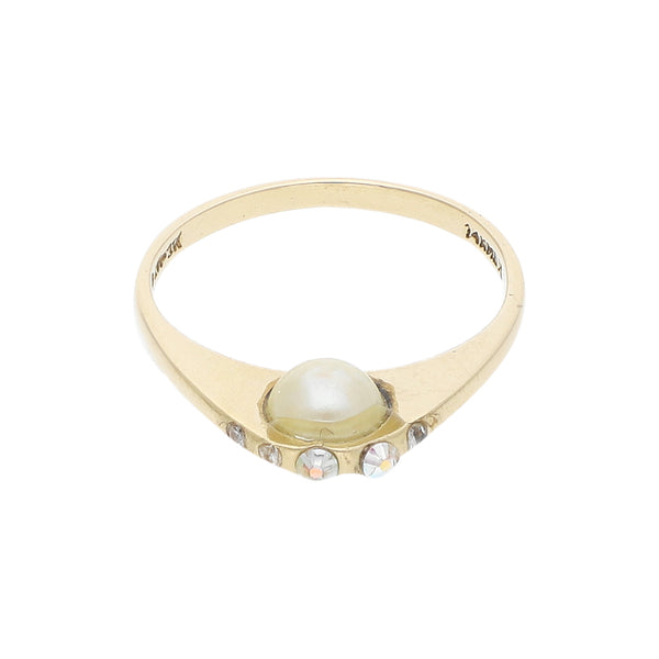 Anillo diseño especial con perla y sintéticos en oro amarillo 14 kilates.