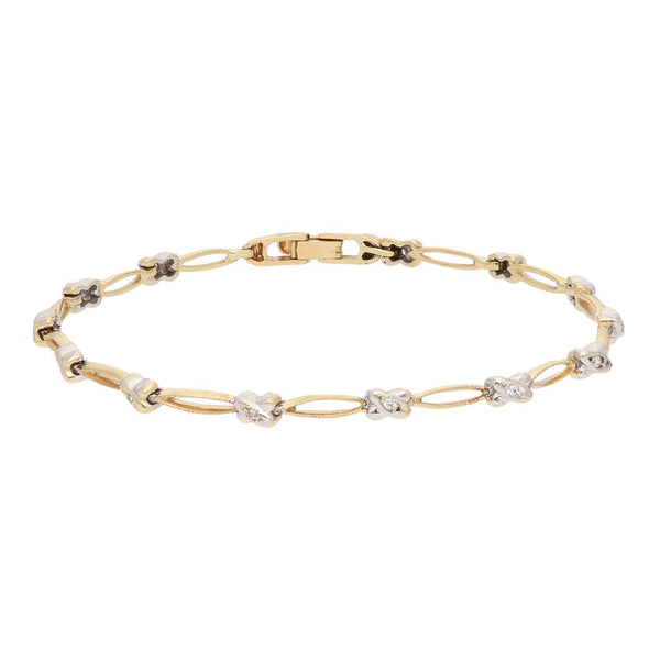 Pulsera eslabón articulado con circonias en oro dos tonos 14 kilates.