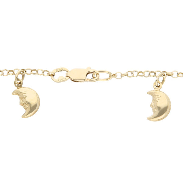 Pulsera eslabón cruzado con colgantes motivo sol y luna en oro tres tonos 14 kilates.