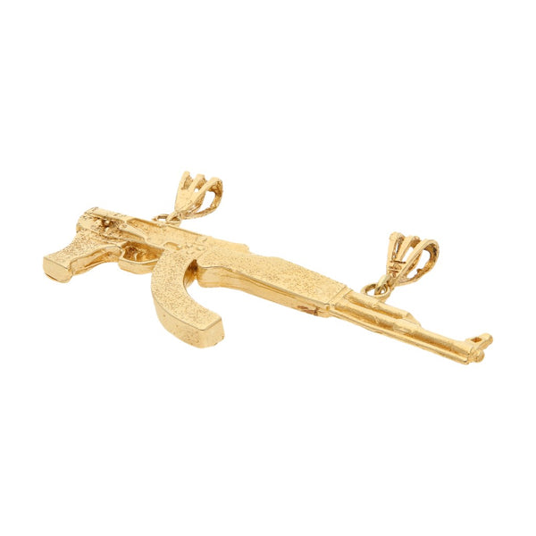 Dije diseño especial motivo fusil en oro amarillo 12 kilates.