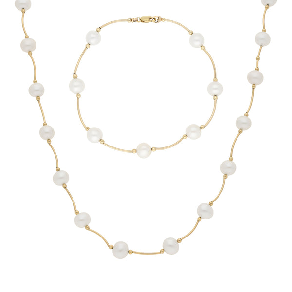 Juego de pulsera y gargantilla eslabón articulado con perlas en oro amarillo 14 kilates.