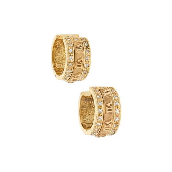 Arracadas articuladas con aplicaciones y circonias motivo números romanos en oro amarillo 14 kilates.