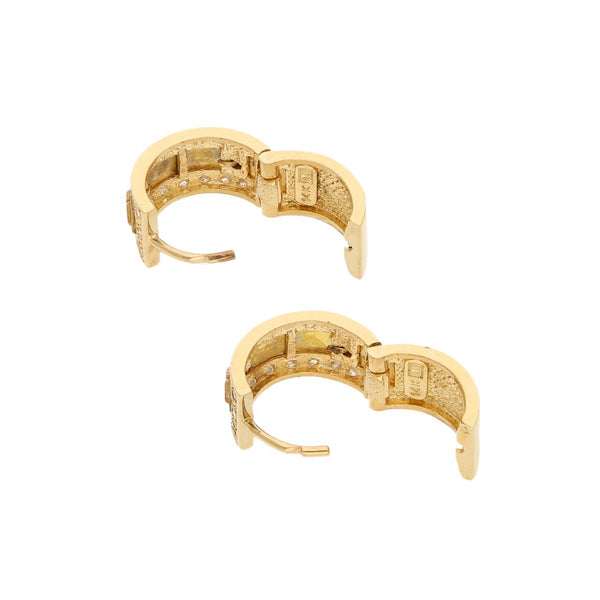 Arracadas articuladas con aplicaciones y circonias motivo números romanos en oro amarillo 14 kilates.