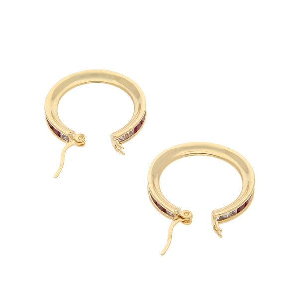 Arracadas diseño especial con sintéticos en oro amarillo 14 kilates.