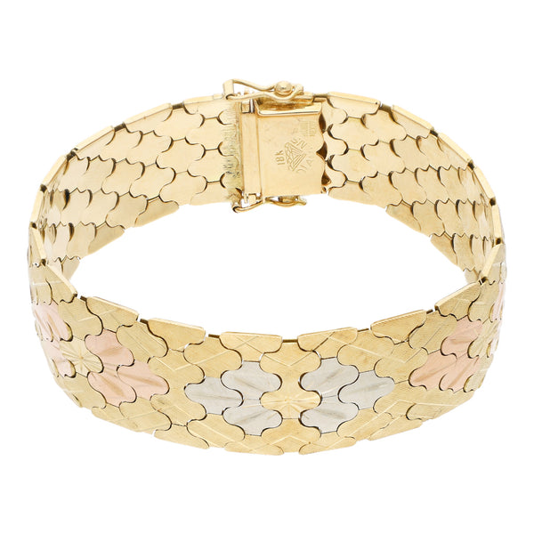 Pulsera eslabón articulado en oro tres tonos 18 kilates.
