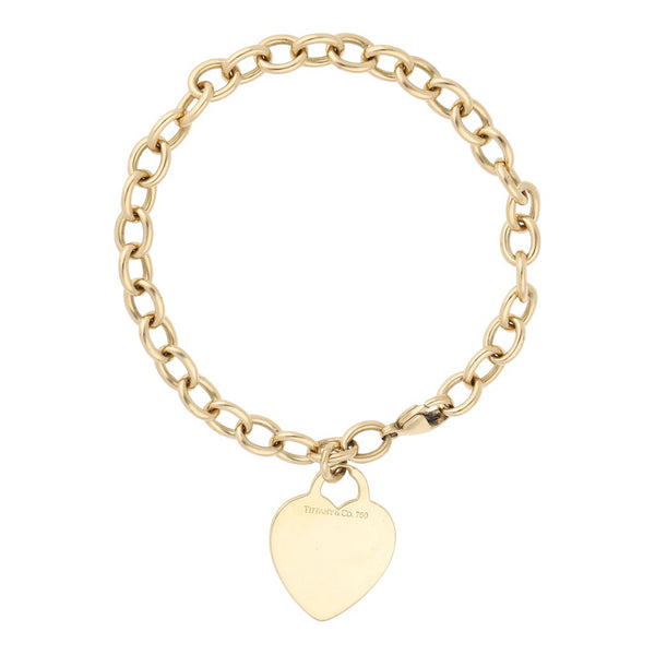 Pulsera eslabón cruzado con colgante motivo corazón firma Tiffany & Co. en oro amarillo 18 kilates.