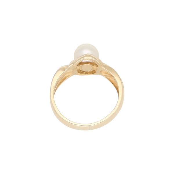 Anillo diseño especial con perla en oro amarillo 14 kilates.