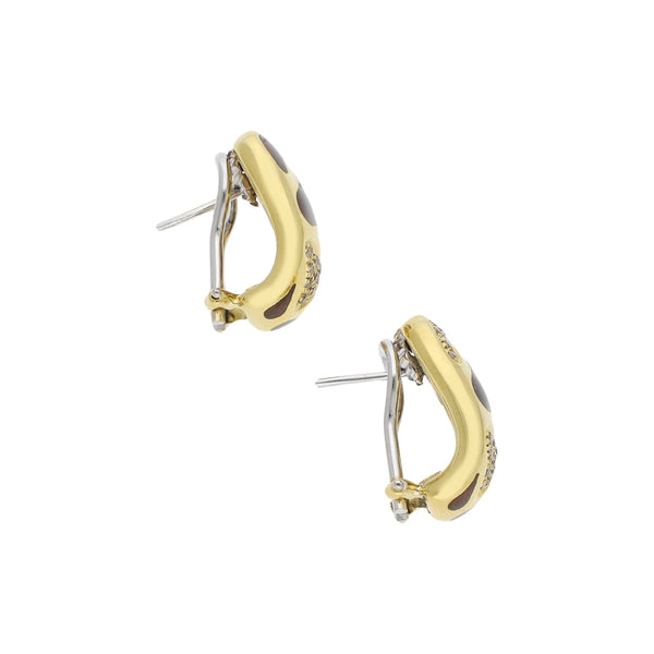Aretes diseño especial con diamantes y esmalte en oro amarillo 18 kilates.
