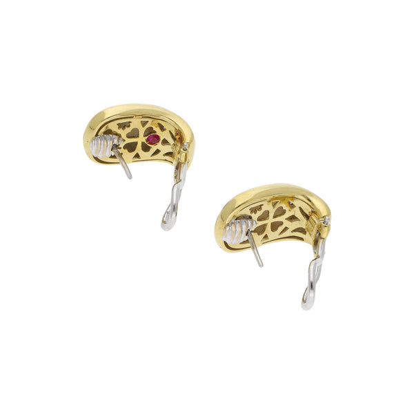 Aretes diseño especial con diamantes y esmalte en oro amarillo 18 kilates.