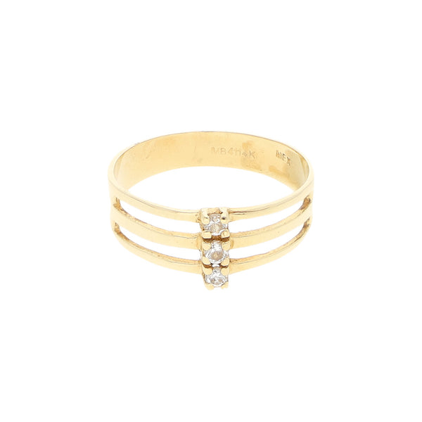 Anillo calado con circonias en oro amarillo 14 kilates.