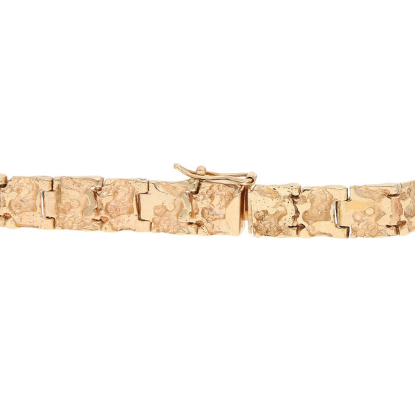 Pulsera eslabón articulado con en oro rosa 14 kilates.
