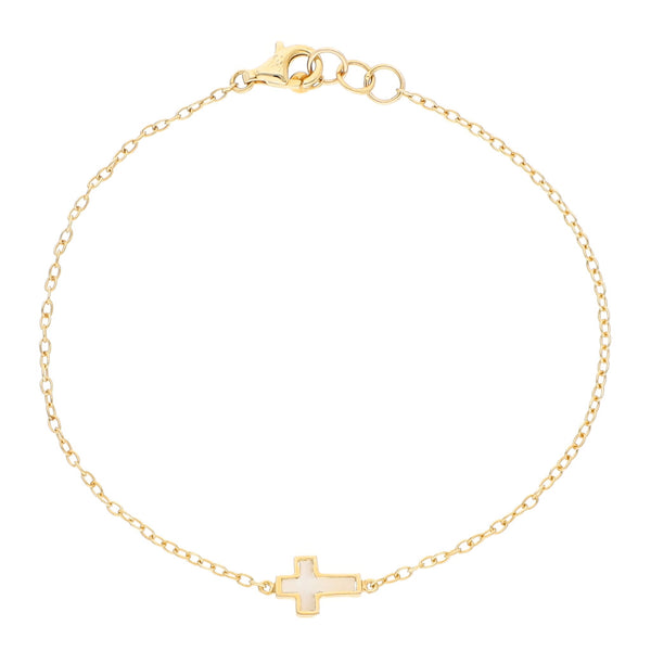 Pulsera eslabón cruzado con aplicación motivo cruz y sintético firma Tous en oro amarillo 18 kilates.