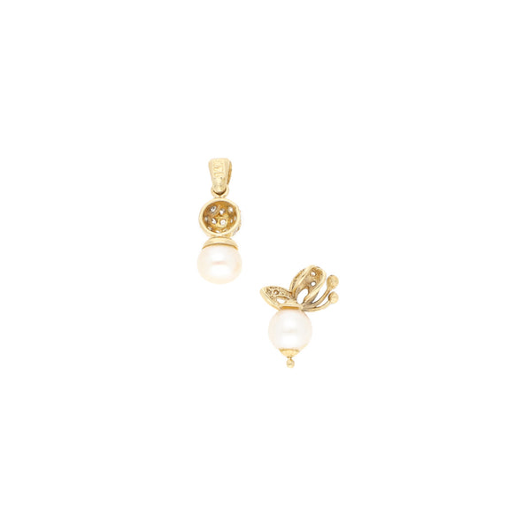 Dos dijes diseño especial con perlas y sintéticos en oro amarillo 14 kilates.
