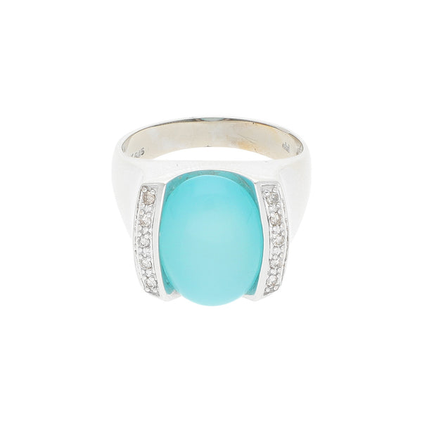 Anillo diseño especial con diamantes y sintético en oro blanco 14 kilates.