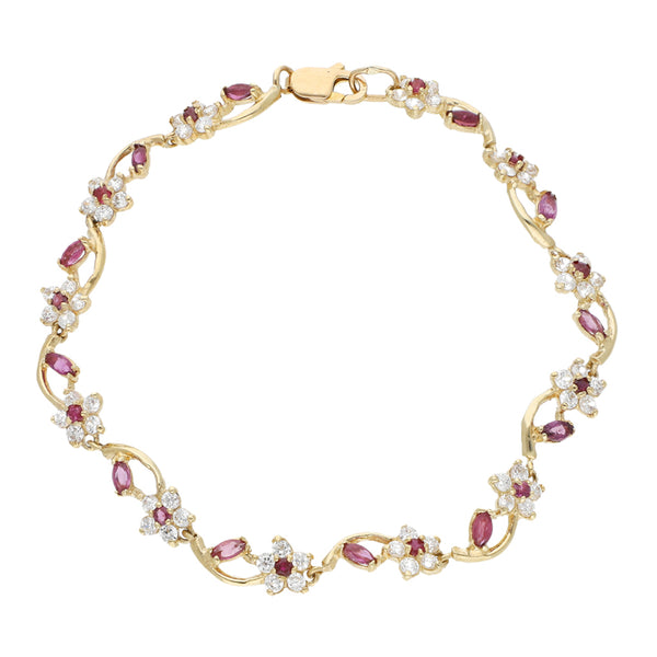 Pulsera eslabón articulado motivo flores con sintéticos en oro amarillo 12 kilates.