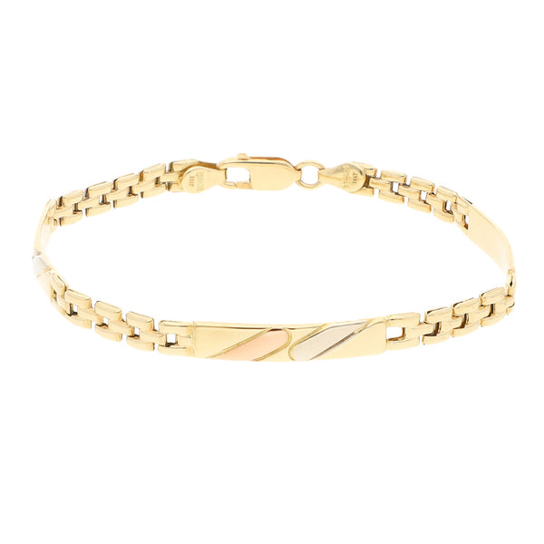 Pulsera eslabón articulado con aplicaciones motivo placa en oro amarillo 14 kilates.