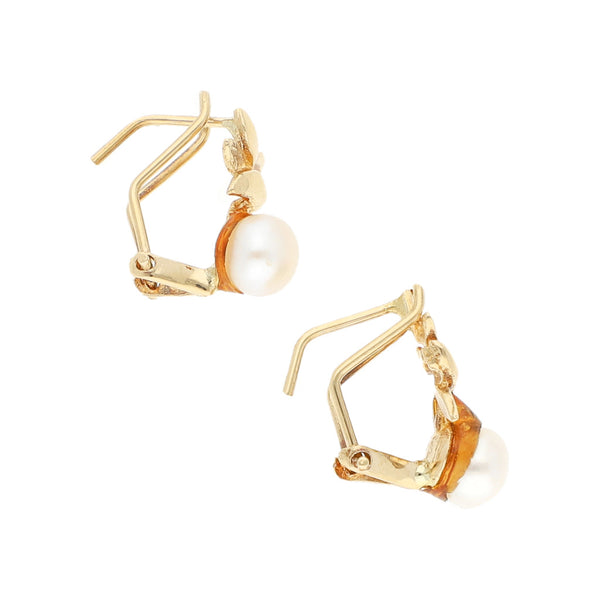 Aretes diseño especial con perla en oro amarillo 14 kilates.