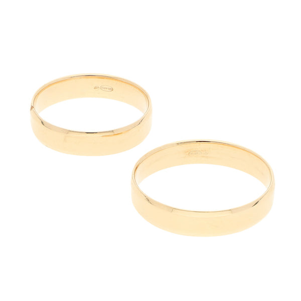 Dos argollas lisas en oro amarillo 14 kilates.
