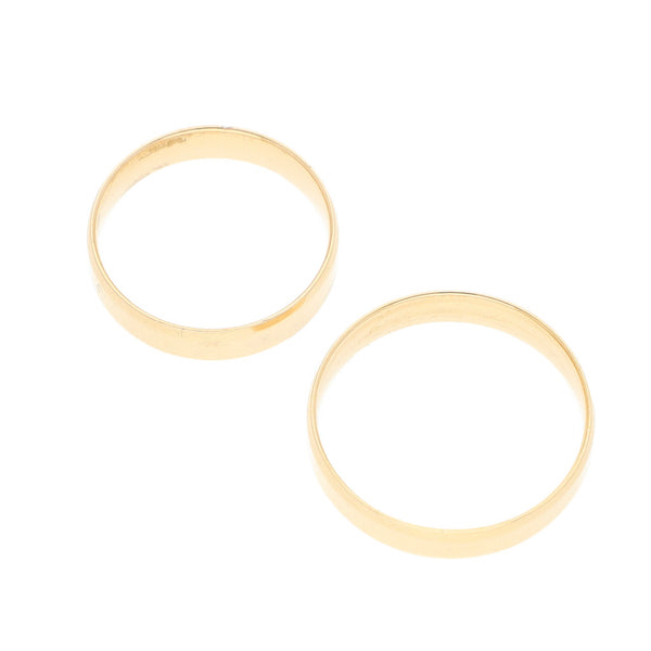 Dos argollas lisas en oro amarillo 14 kilates.