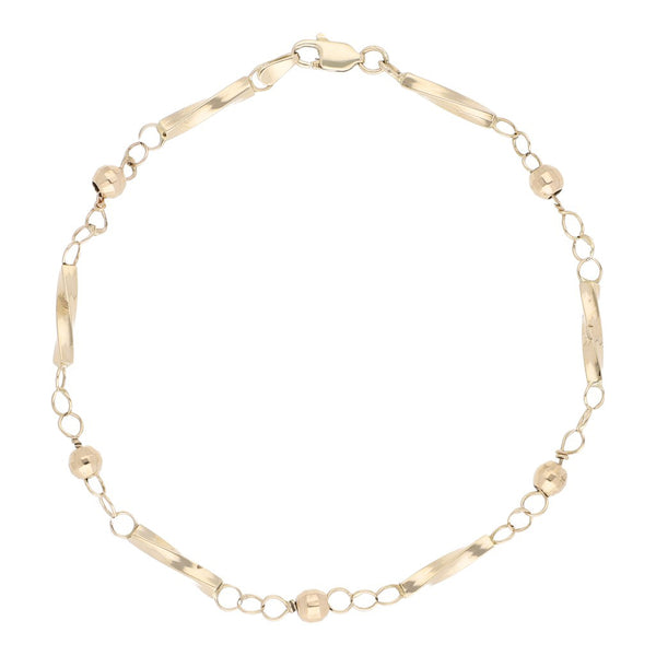 Pulsera eslabón articulado con aplicaciones motivo esferas en oro amarillo 14 kilates.