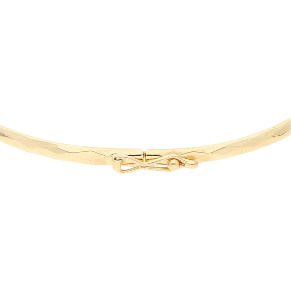 Pulsera de arillo facetada en oro amarillo 14 kilates.