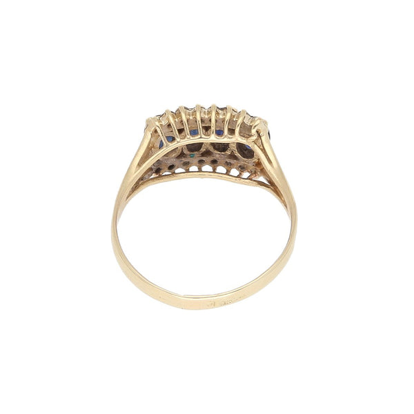 Anillo diseño especial con diamantes y sintéticos en oro amarillo 14 kilates.