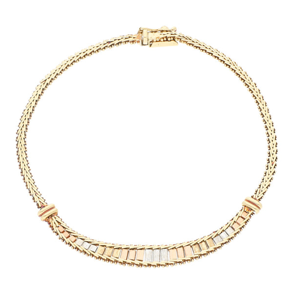 Pulsera boleada en oro tres tonos 14 kilates.