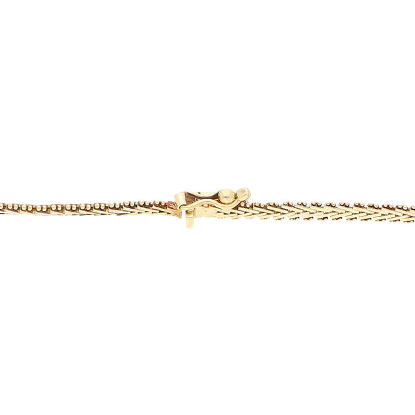 Pulsera boleada en oro tres tonos 14 kilates.