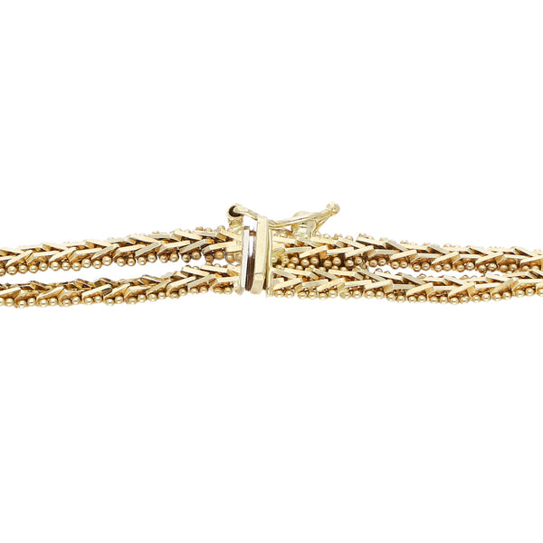 Pulsera eslabón boleado en oro tres tonos 14 kilates.