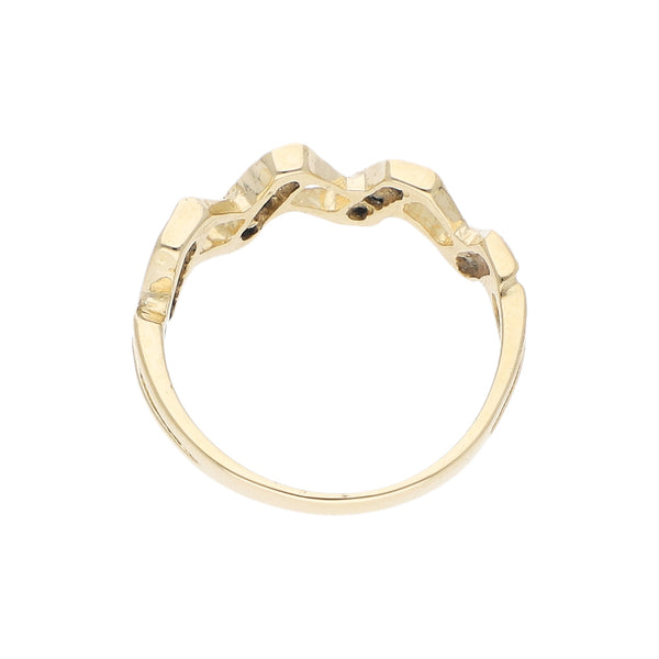 Anillo estilizado con sintéticos en oro amarillo 14 kilates.