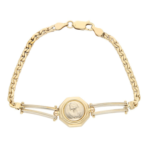 Pulsera eslabón combinado con aplicación motivo rostro femenino en oro dos tonos 14 kilates.