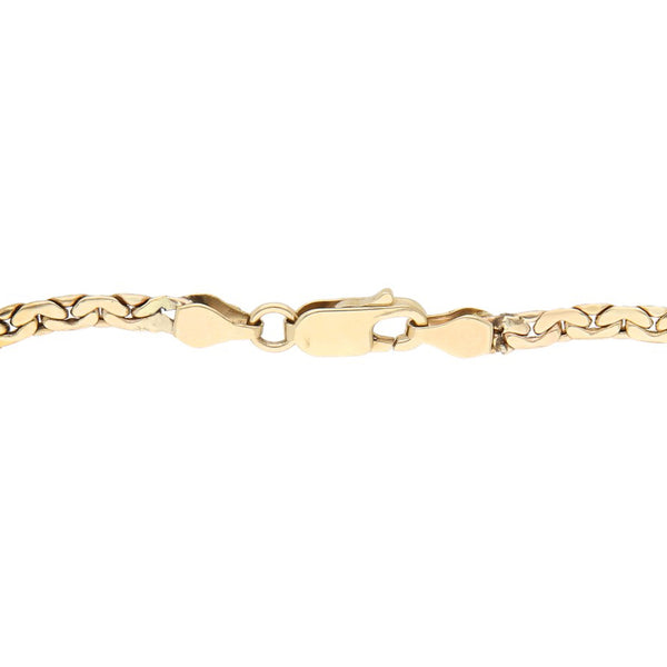 Pulsera eslabón combinado con aplicación motivo rostro femenino en oro dos tonos 14 kilates.