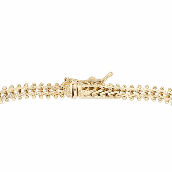 Pulsera boleada en oro tres tonos 14 kilates.