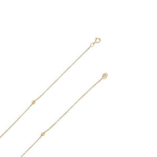 Collar eslabón cuadrado cruzado con aplicaciones en oro amarillo 14 kilates.
