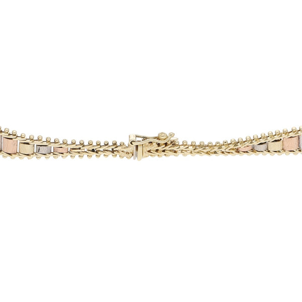 Pulsera eslabón boleado en oro tres tonos 14 kilates.