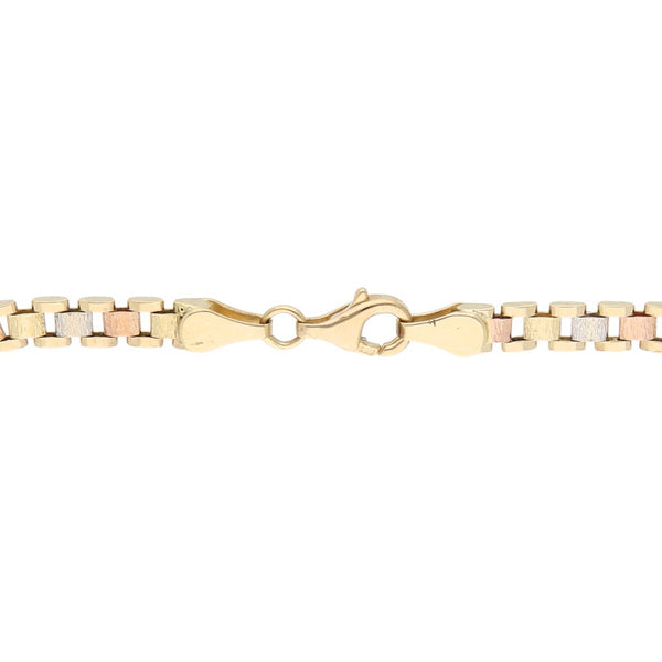 Pulsera eslabón articulado en oro tres tonos 14 kilates.