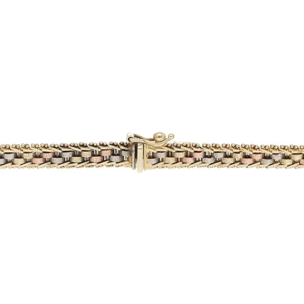 Pulsera eslabón barbado en oro tres tonos 14 kilates.