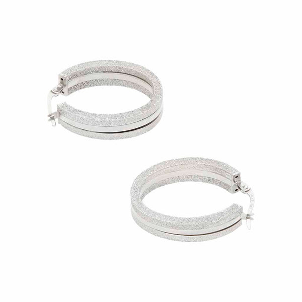 Arracadas labradas en oro blanco 14 kilates.