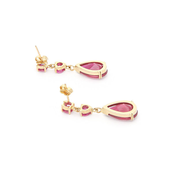 Aretes diseño especial con rubíes en oro amarillo 14 kilates.