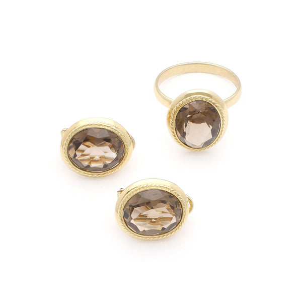 Juego de anillo y aretes diseño especial con Topacio en oro amarillo 14 kilates.