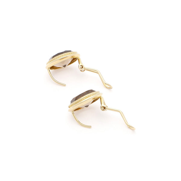 Juego de anillo y aretes diseño especial con Topacio en oro amarillo 14 kilates.