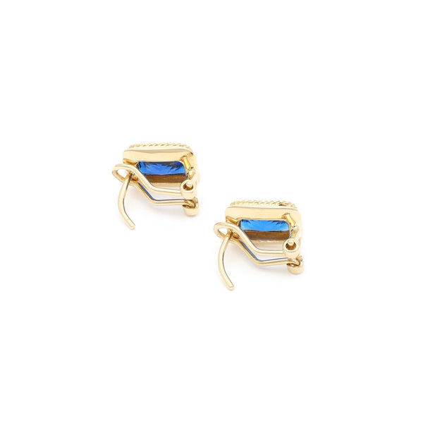 Aretes diseño especial con zafiros en oro amarillo 14 kilates.