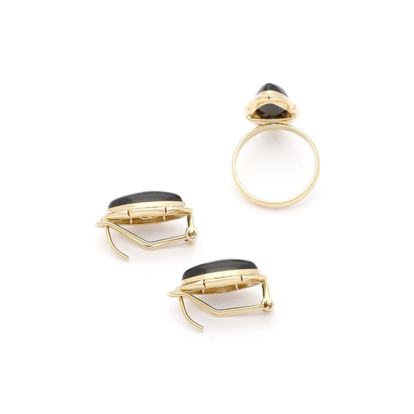 Juego de anillo y aretes calados en oro amarillo 14 kilates.