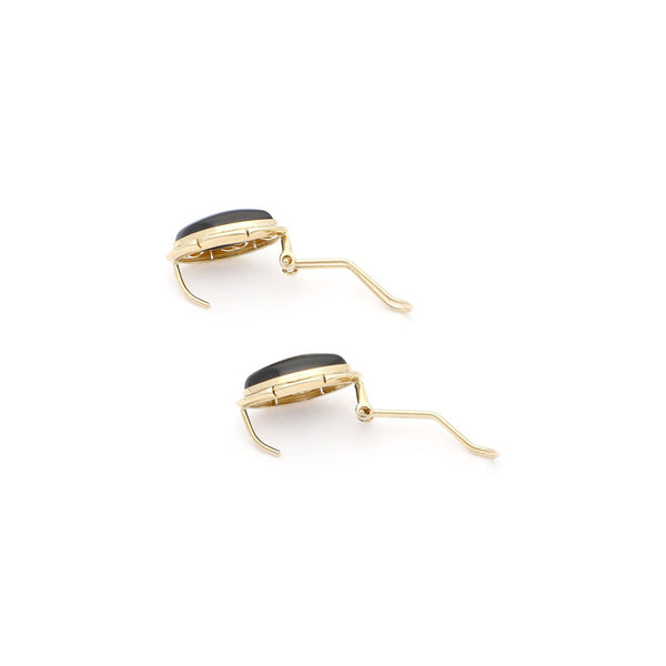 Juego de anillo y aretes calados en oro amarillo 14 kilates.