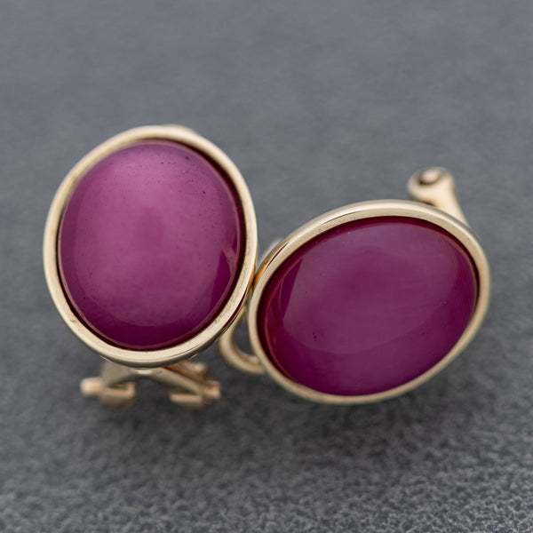Aretes diseño especial con rubíes en oro amarillo 14 kilates.